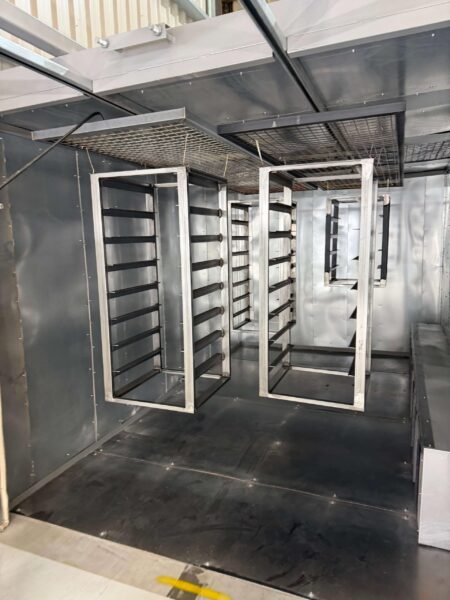 A batch of fabricated frames loaded into the oven for their out-gassing cycle